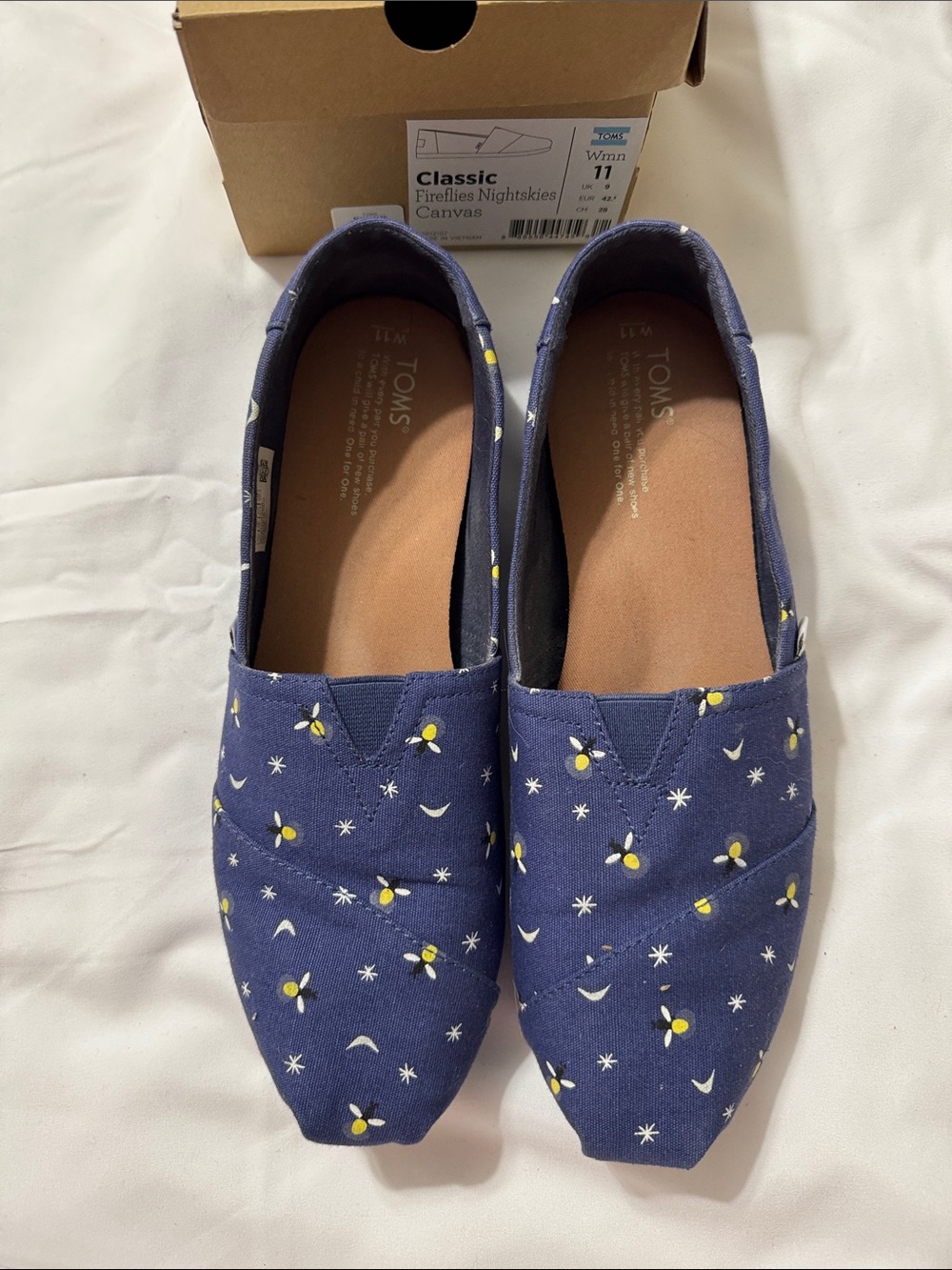 Toms navy canvas slip-ons with yellow firefly print - Picture 1 of 3
